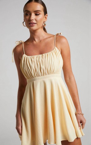 Showpo Aziah Mini Dress - Tie Shoulder Ruched Bodice Dress Butter Yellow | ZAMRVO850