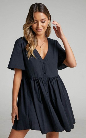 Showpo Staycation Mini Dress - Smock Button Up Dress Black | DECQPO590